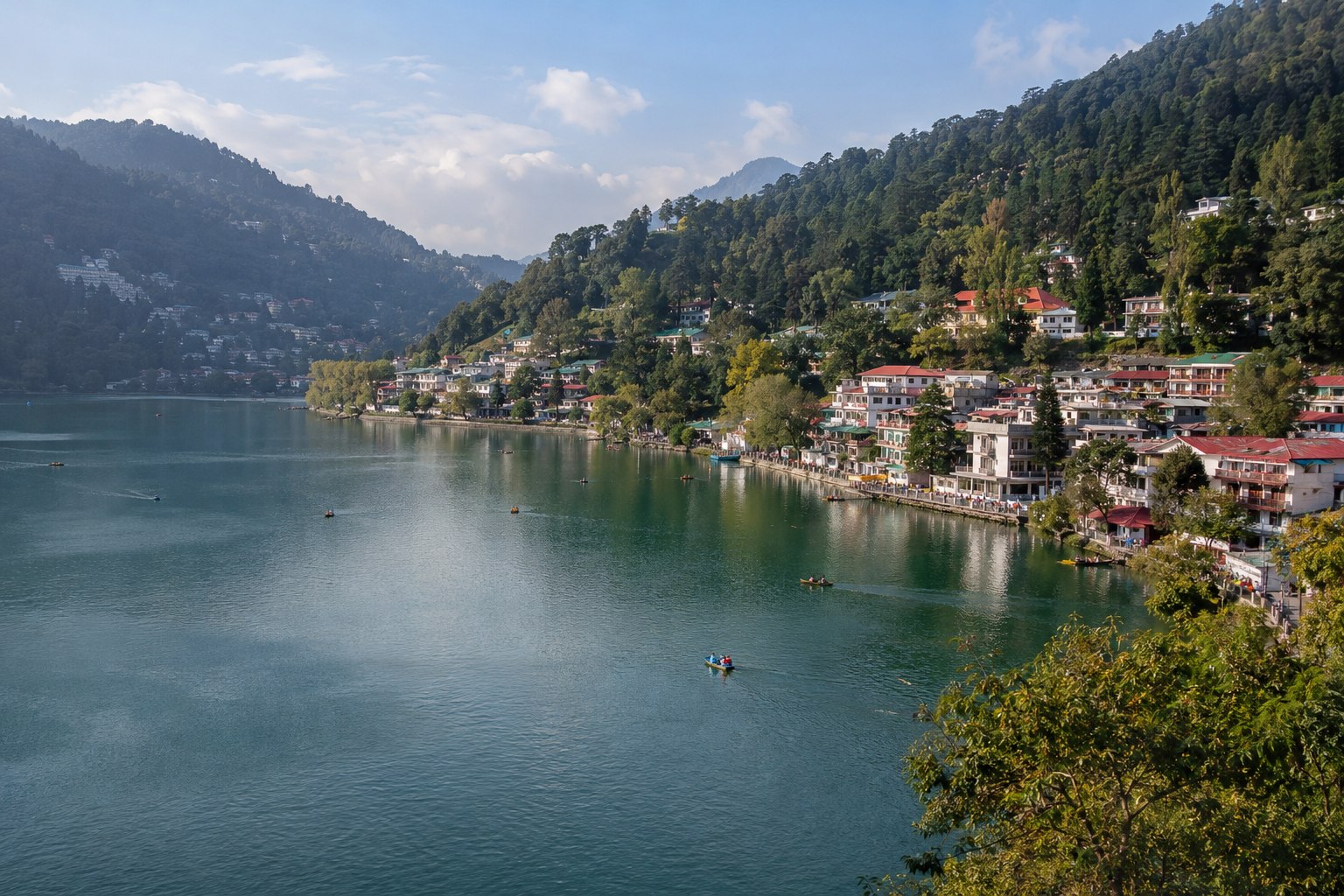 Boats and lakeside buildings beside Naini Lake