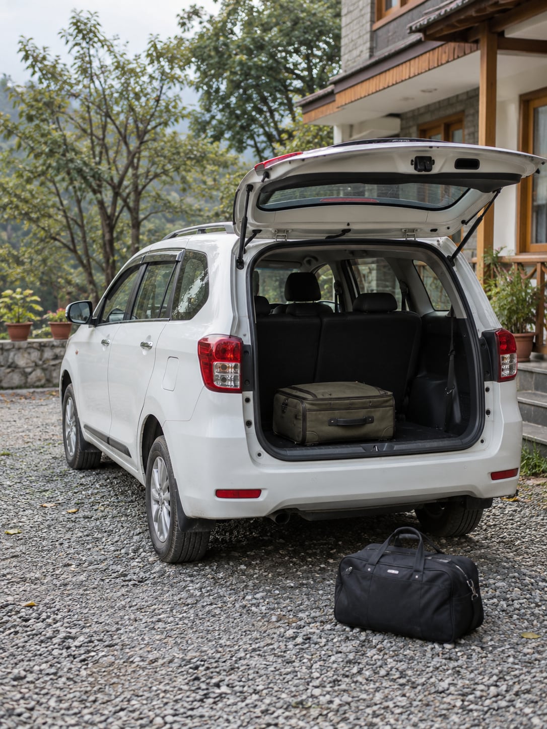 A parked passenger vehicle with a compact bag ready for a hill-town transfer.