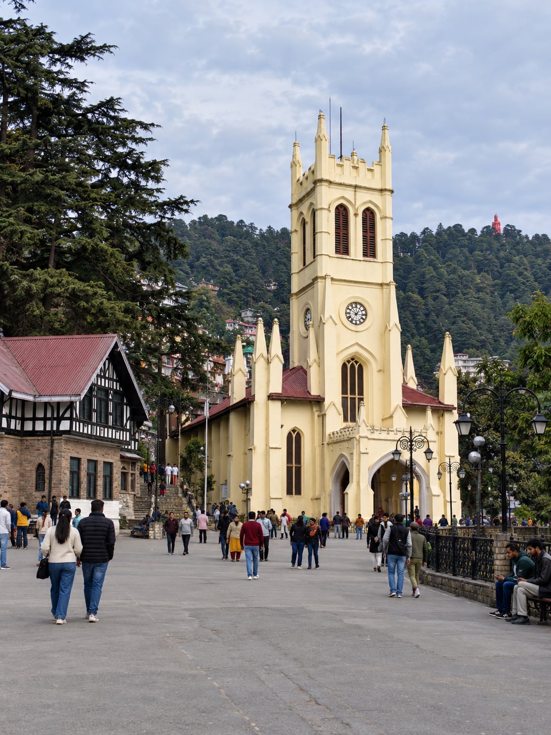 Illustration of pedestrians on Shimla's Ridge, with Christ Church, the heritage library and wooded hills.